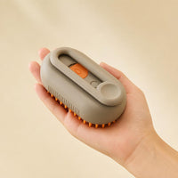 Steam brush held in one hand to show its compact size